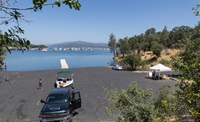 California Department of Water Resources and consultant staff perform watercraft inspections for invasive golden mussels at State Water Project facilities in Oroville. Mussel inspections and decontamination services are offered at the North Thermalito Forebay, with staff checking for blue Oroville seals indicating a passed inspection at launch ramps. Photo taken June 3, 2025.