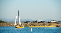 A sailboat passes the boat ramp at the Thermalito Forebay Recreation Area South in Butte County, California. Photo taken July 4, 2017.