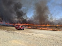 CAL FIRE Butte County crews monitor a controlled burn in the Thermalito Forebay area to minimize invasive and dried grasses.