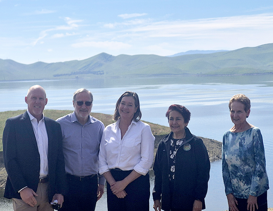 From left, Western Municipal Water District General manager Craig Miller, California Water Commissioner Dan Curtin, Department of Water Resources Director Karla Nemeth, Senator Anna Caballero, and California Water Commission Chair Fern Steiner at the San Luis Reservoir in Merced County on March 13, 2026.