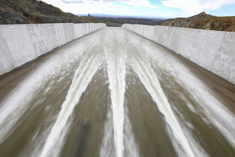 The California Department of Water Resources releases water from the Lake Oroville flood control gates down the main spillway from 4,000 cubic feet per second (cfs) to 8,000 cfs for the first time since April of 2019 in Butte County, California.