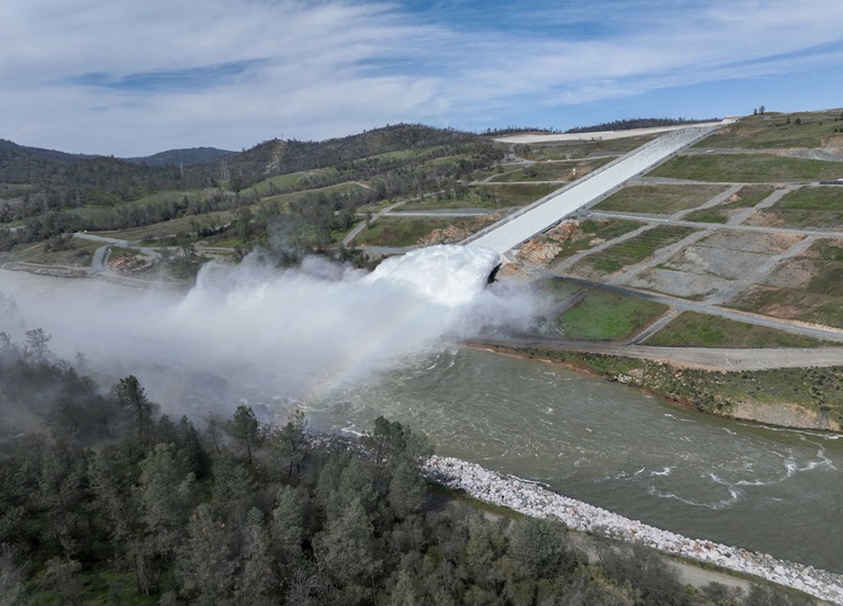 A drone provides an aerial view of a cloud mist formed as water flows over the four energy dissipater blocks at the end of the Lake Oroville Main Spillway. Photo taken March 17, 2023.