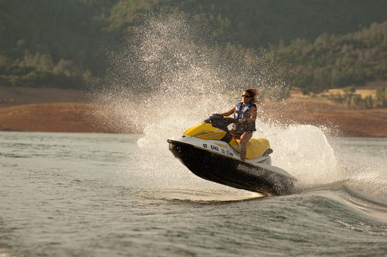 A woman enjoys jet skiing at Lake Oroville