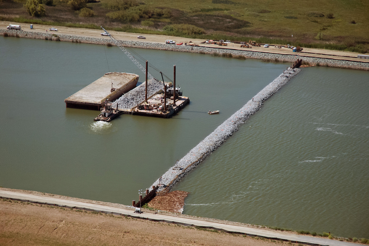 This aerial view from June 2015 looks south toward the temporary rock barrier in the Sacramento-San Joaquin Delta at West False River. The temporary 750-foot wide barrier is to control water salinity into the Delta and preserve water in upstream reservoirs.