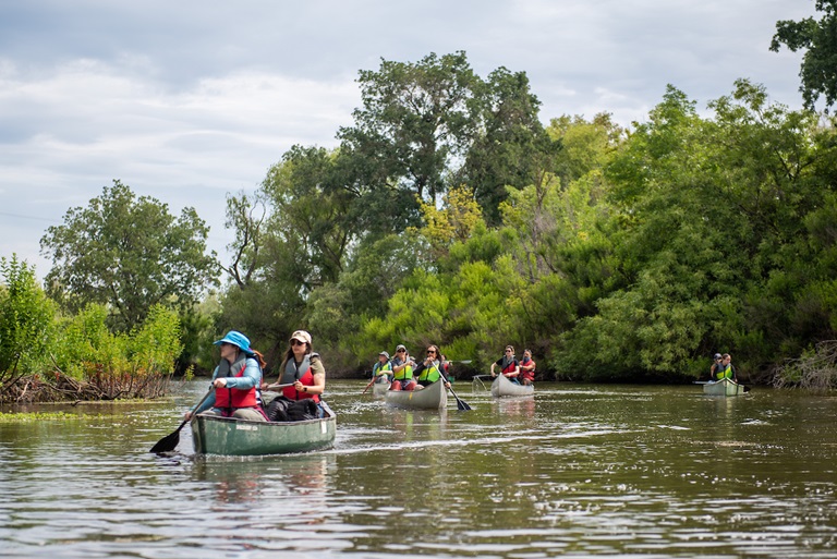 Delta region educators launch canoes and paddle the Cosumnes River in Sacramento County, California, during a workshop of the California Water Institute for Teachers at the Cosumnes River Preserve Visitor Center in Galt, California on June 12, 2023.