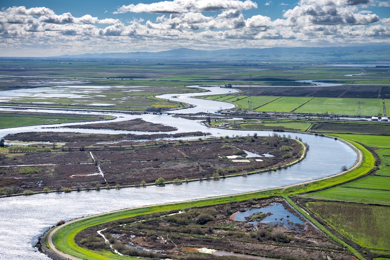 Aerial view looking south along Old River in the center is Fay Island, part of the Sacramento-San Joaquin River Delta in San Joaquin County, California.