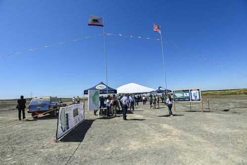 An overall sets the scene before the event began at this groundbreaking ceremony at Lookout Slough in Solano County, California. The project will expand the Yolo Bypass by creating 40,000 acre-feet of storage to prevent dangerous flooding and protect neighboring communities and related infrastructure, while providing a three-mile setback levee replacing existing deficient levees and creating 20 miles of open tidal channels. 