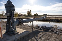 A groundwater well by an irrigation canal in Maxwell, California. Photo taken November 29, 2023.
