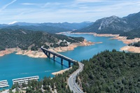 The Pit River Bridge spans Lake Shasta in this aerial view of low water conditions when on this date, the storage was 1,820,933 AF (Acre Feet) which is 40 percent of Total Capacity. Photo taken May 24, 2022.