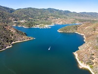 Silverwood Lake, a large reservoir in San Bernardino County, California. Silverwood Lake is located on the West Fork Mojave River, a tributary of the Mojave River in the San Bernardino Mountains. It was created in 1971 as part of the State Water Project by the construction of the Cedar Springs Dam as a forebay on the 444 mi long California Aqueduct. Photo taken August 10, 2022.