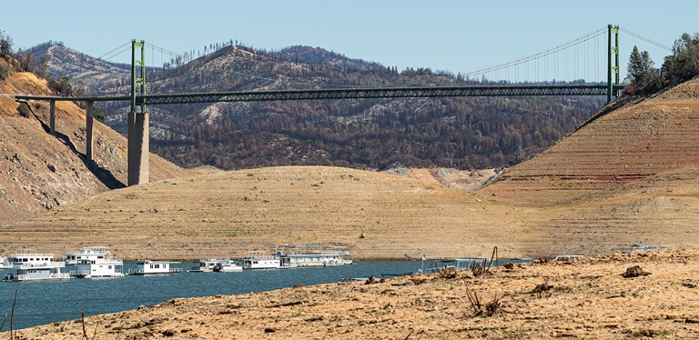 The Bidwell Bar Bridge and houseboats near the Bidwell Canyon Marina on Lake Oroville on September 28, 2021.