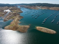 With visibly low water conditions shown in this aerial photograph taken via drone at Lake Oroville in Butte County, the Loafer Point Stage 2 Boat Ramp on the left, and the Bidwell Canyon Boat Ramp on the right, are visible on a day when storage was 1,218,591 AF (Acre Feet) or 34% of total capacity  Photo taken October 5, 2022. 
