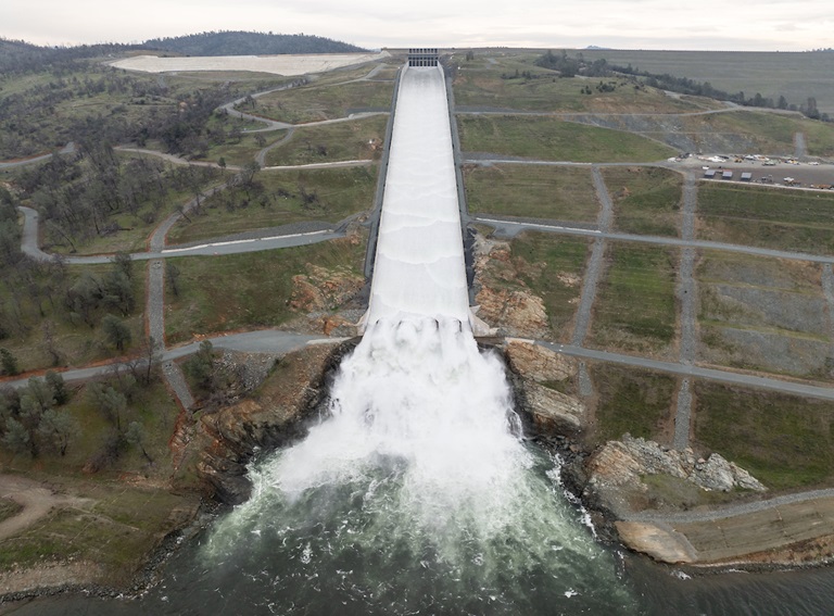 A drone provides an aerial view of the California Department of Water Resources first 2024 water release from the Lake Oroville flood control gates, as water flows over the four energy dissipator blocks at the end of the Lake Oroville Main Spillway in Butte County, California. Photo taken January 31, 2024.