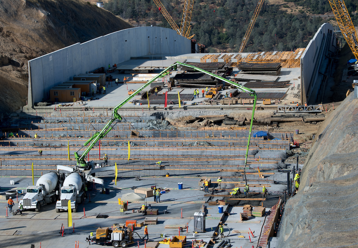 Leveling concrete is pumped onto a section of the upper chute of the Lake Oroville main spillway.