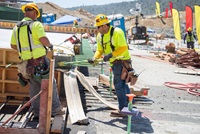 Workers remove concrete forms from a finished structural concrete panel on the middle chute of the Lake Oroville main spillway during Phase 2 of the recovery effort .