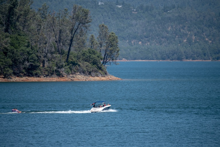 A nearly full Lake Oroville provides perfect conditions for boaters just north of the main spillway at the Butte County, California site. 