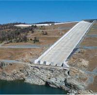 Oroville Dam Flood Control Outlet (FCO) or main spillway with emergency spillway visible in top left