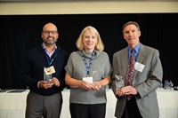DWR staff members Sergio Fuentes and Jeanne Kuttel, with Bill Spragins, consultant, pictured receiving DWR's project of the year award from the International Partnering Institute for their levee restoration work in the San Joaquin Valley.