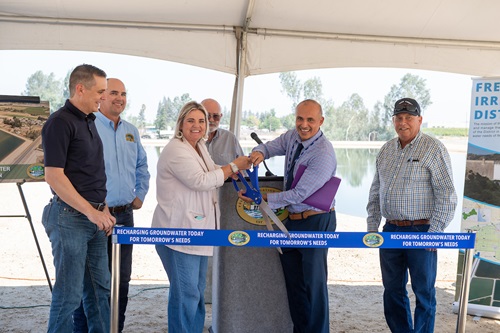 A ribbon cutting is held by the Fresno Irrigation District for the Savory Pond Expansion project in Fresno, California. 
