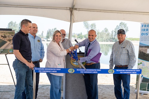 A ribbon cutting is held by the Fresno Irrigation District for the Savory Pond Expansion project in Fresno, California.