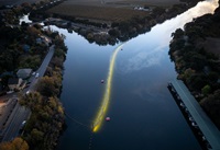 A drone photo shows the California Department of Water Resources’ bioacoustic fish fence installed at the junction of the Sacramento River, right, and Georgiana Slough at Walnut Grove in Sacramento County, California. Photo taken November 30, 2023.