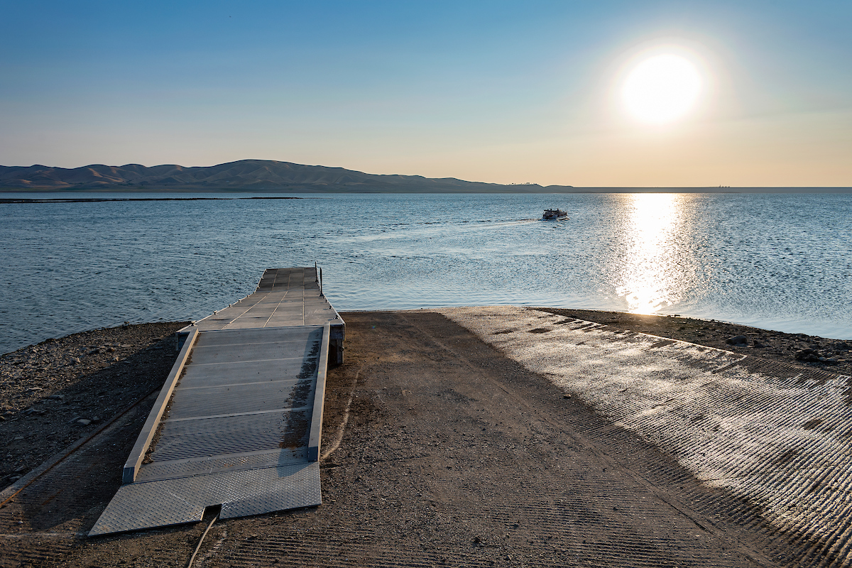 Fishermen head out from this dock near Dinosaur Point on the San Luis Reservoir near dawn in Merced County on Aug. 23, 2021.