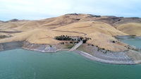 An aerial drone view of the Basalt Boat Ramp showing part of an algae bloom in the San Luis Reservoir. DWR/2019