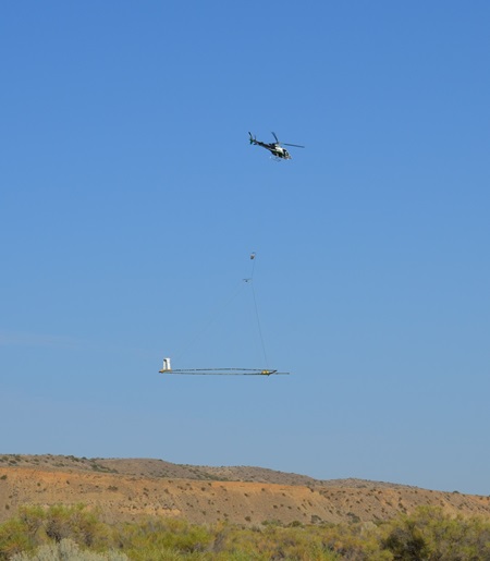 A helicopter performing an AEM survey