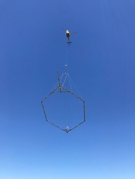 Helicopter preforming an AEM survey