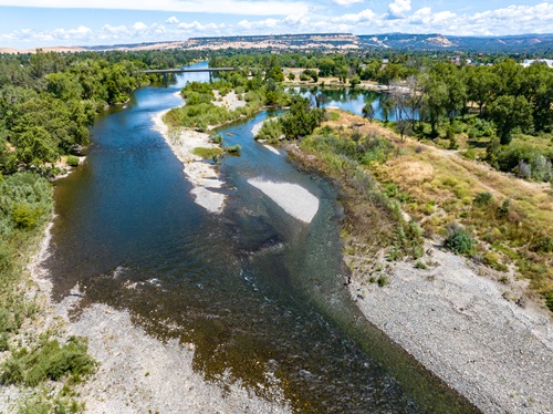 Aerial view of the Feather River in Oroville with the Highway 162 overcrossing in the background. 