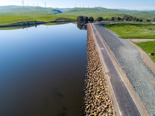 A drone aerial view of Bethany Dams and Reservoir, located on the California Aqueduct and downstream from the Harvey O. Banks Pumping Plant. The reservoir serves as the forebay for the South Bay Pumping Plant and recreational opportunities in Alameda County. 