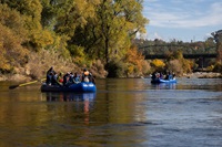 DWR employees participate in a Feather River Floating Classroom tour in Oroville during an environmental sciences workshop, learning about the Fall salmon run. Photo taken November 12, 2024.