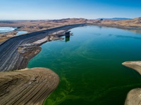 A drone view of San Luis Reservoir with the storage at 363,587 acre feet, 18 percent capacity, or 38 percent of historical average.