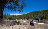 (Left) Sean de Guzman, chief of California Department of Water Resources (DWR), Snow Surveys and Water Supply Forecasting Section, and Andy Reising, water resource engineer, DWR Snow Survey Section and Water Supply Forecast Section, conducts the final snow survey of the 2020 season at Phillips Station in the Sierra Nevada Mountains. The survey was held approximately 90 miles east of Sacramento off Highway 50 in El Dorado County. 